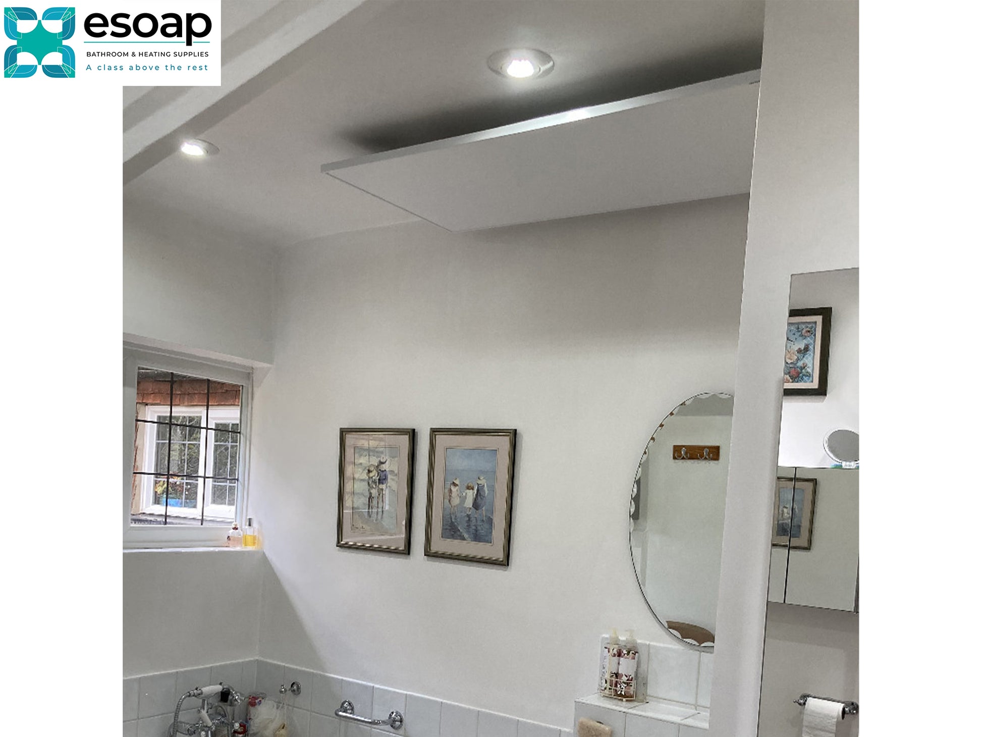 Bathroom interior with framed pictures on the wall and a round mirror and ceiling Silver 350W Classic Infrared Heating Panel