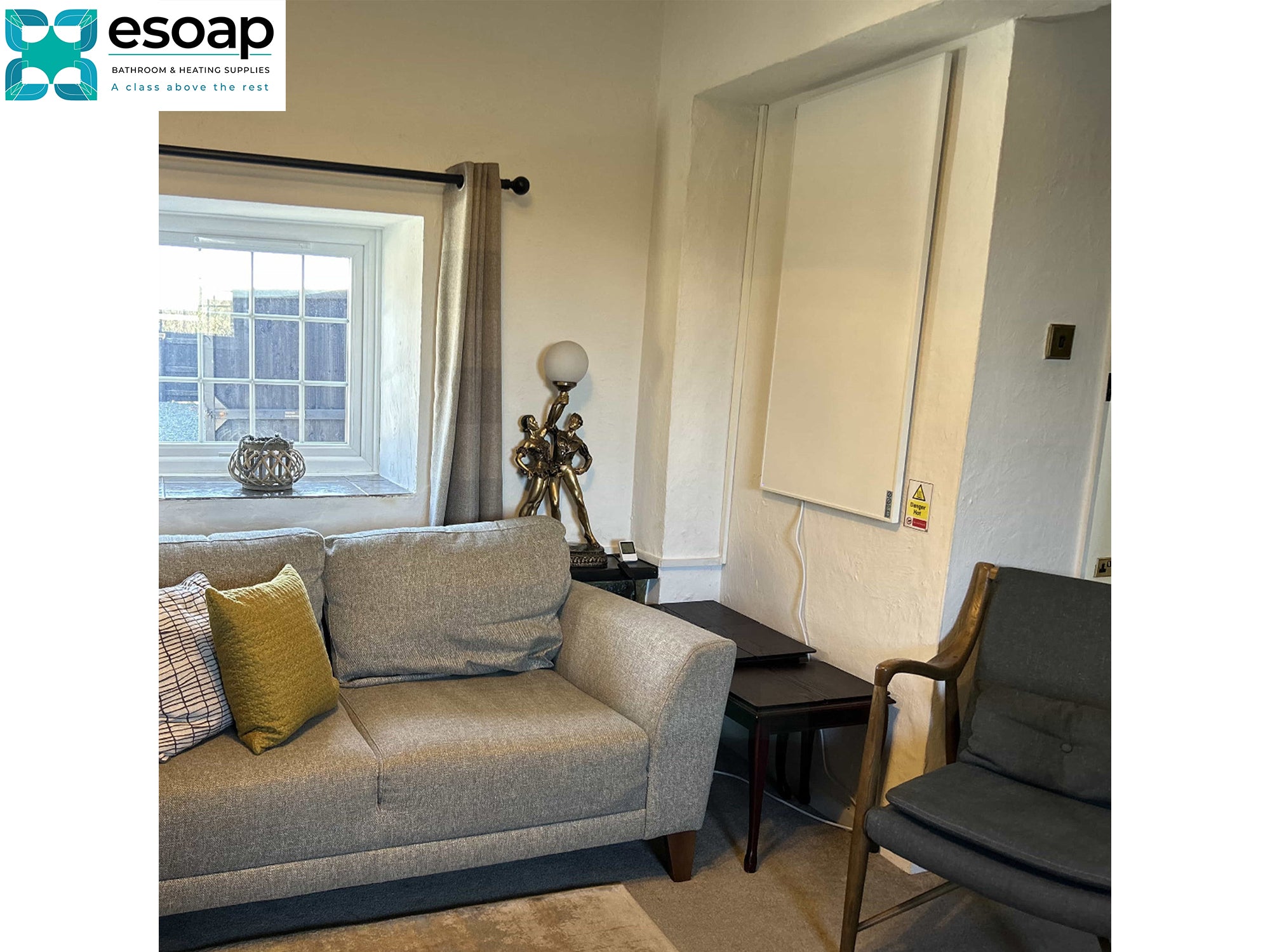 Living room with gray sofa, armchair, and window with curtains with wall White 580W Classic Infrared Heating Panel