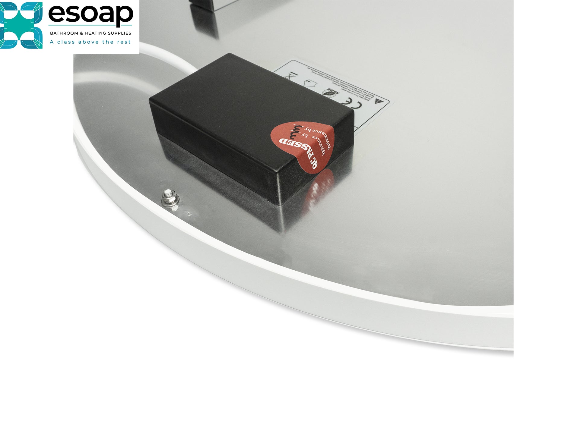 Black rectangular device with a red label on a reflective surface, featuring the Esoap logo for 500W Premium Round Frameless Infrared Heating Panel