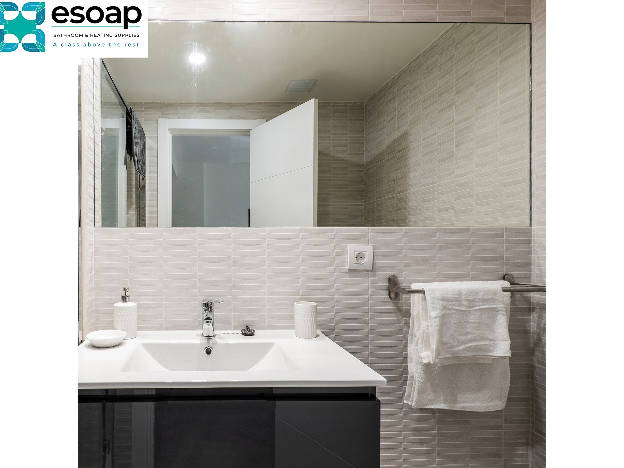 Bathroom with sink, 700W Mirrored Wi-Fi Infrared Heating Panel, and towel rack, featuring the esoap logo.