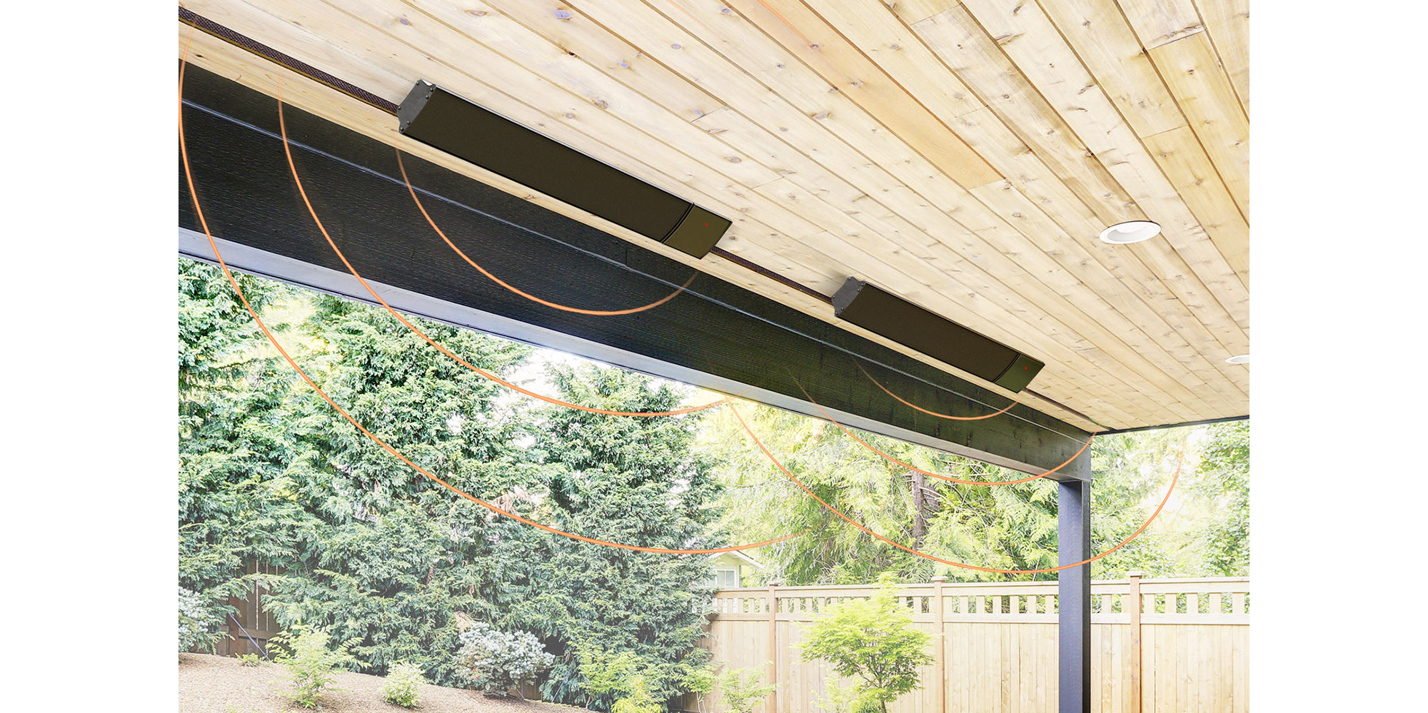 Outdoor patio with ceiling heaters and a view of trees for 1.2kW Hellos Infrared Bar Heater