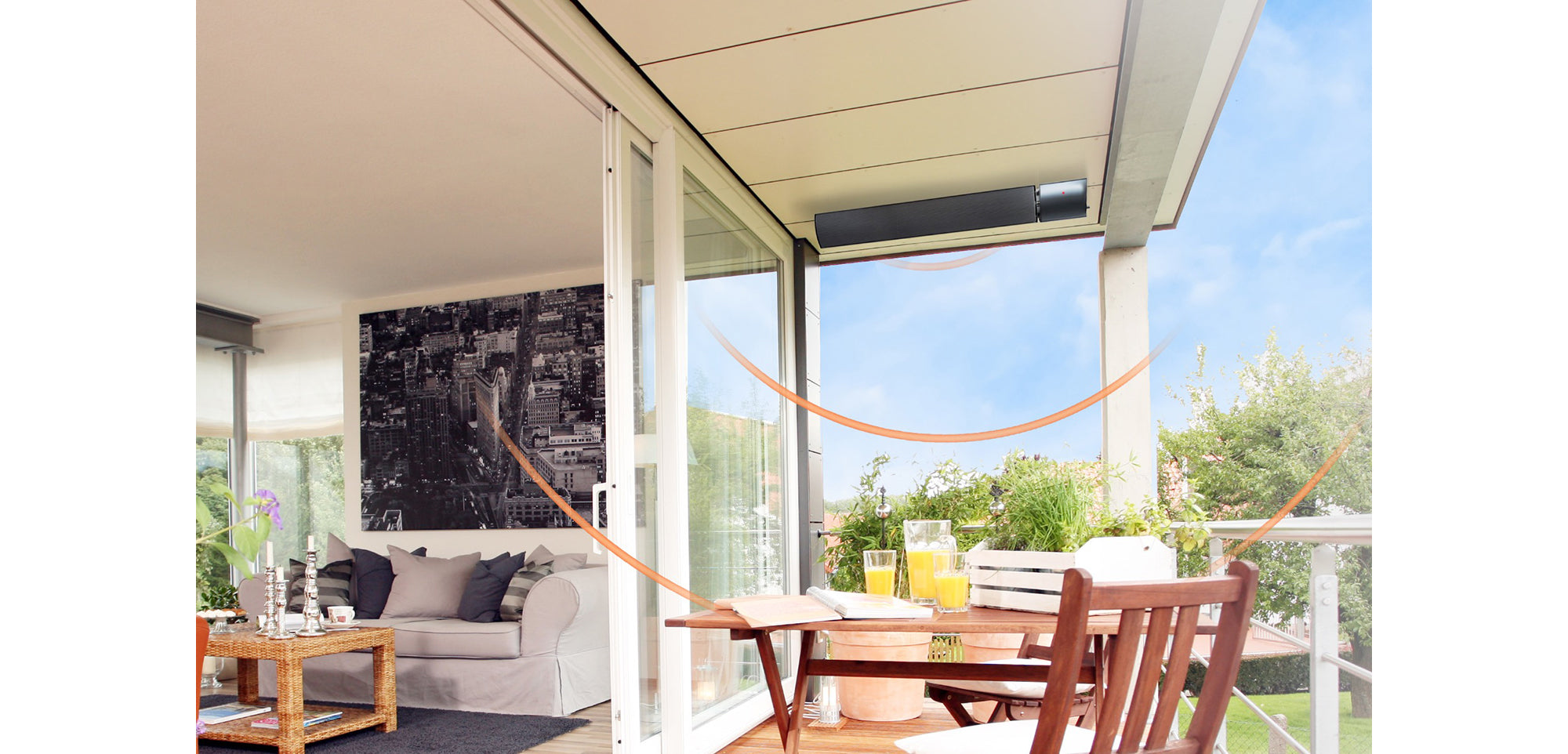 Modern patio with outdoor furniture and a hammock and heater on ceiling