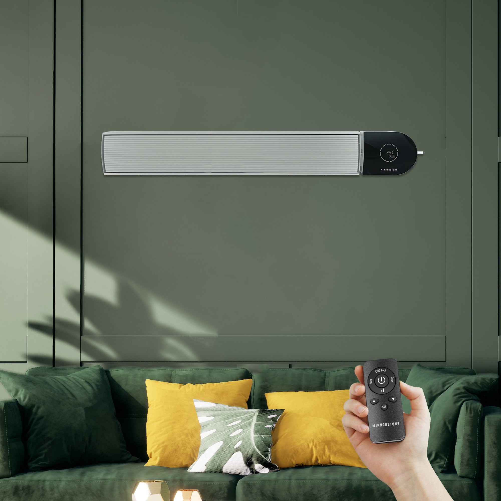 Wall-mounted electric heater with remote control in a living room setting.