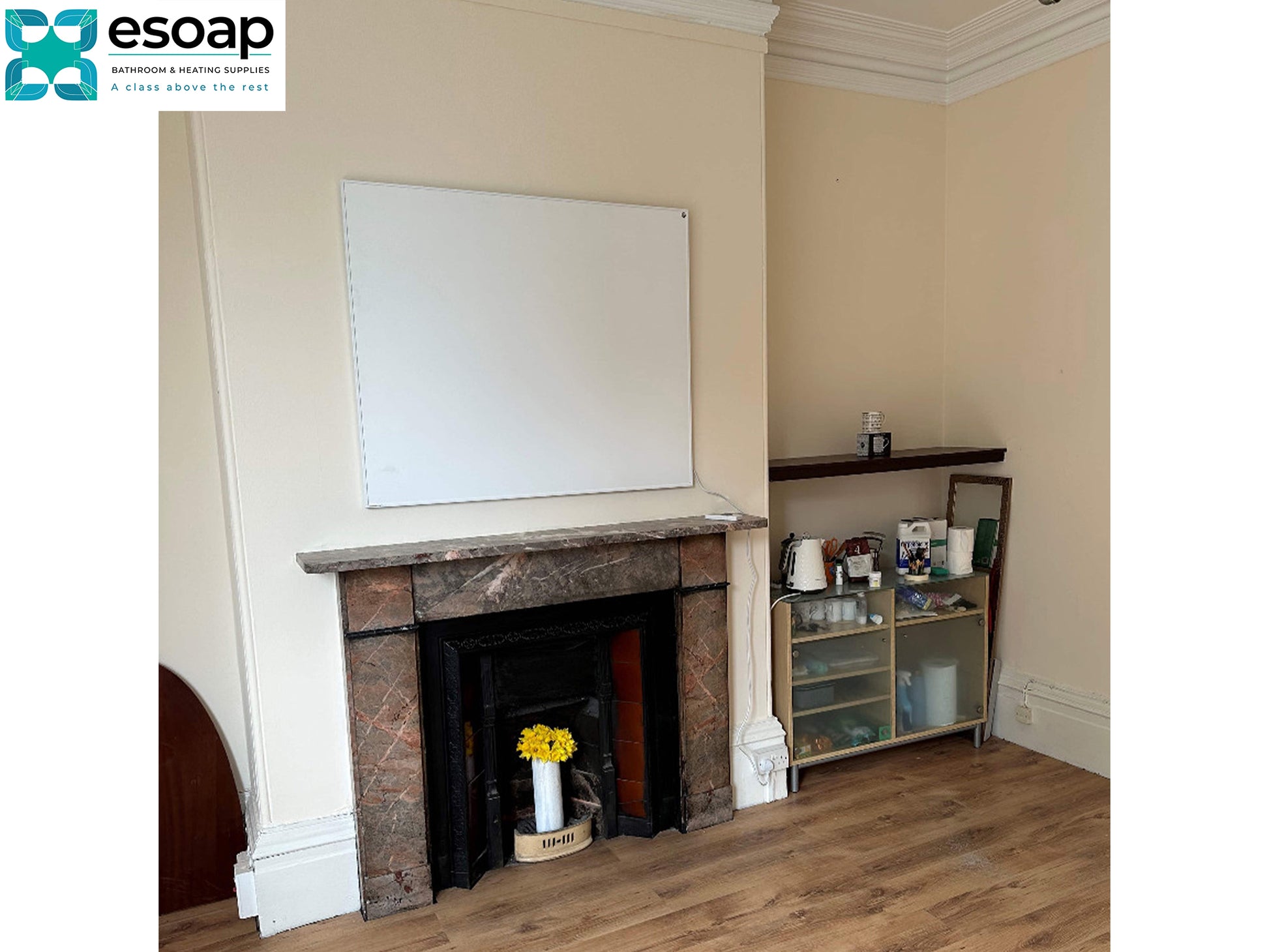 Living room with a fireplace and a shelf displaying various items hanging 700W Classic Infrared Heating Panel Black